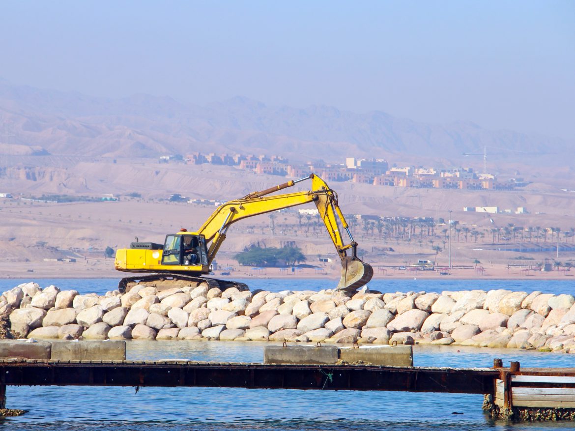 A digger on a platform in the Red Sea