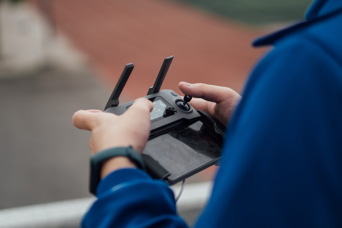 A man controlling a drone