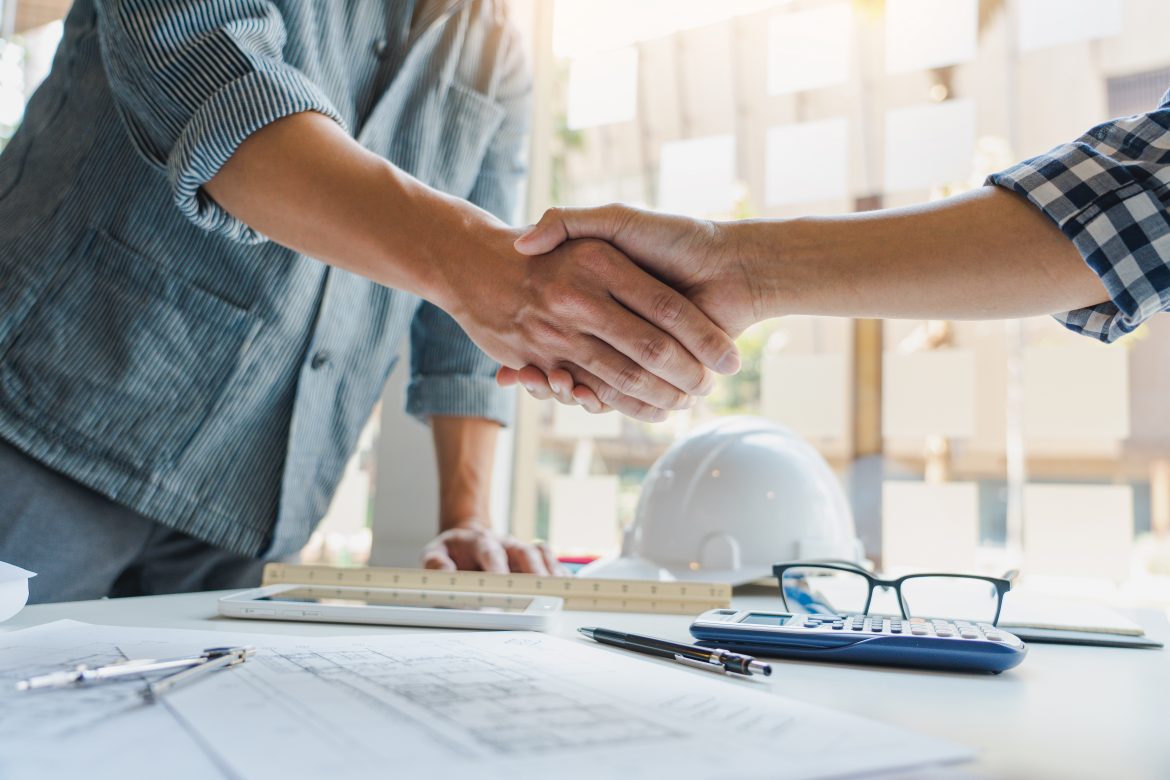 construction professionals shaking hands