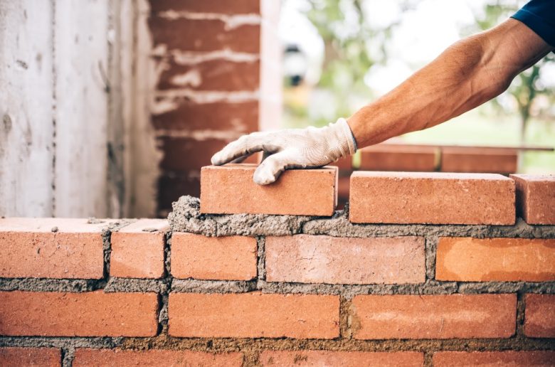 A bricklayer laying bricks